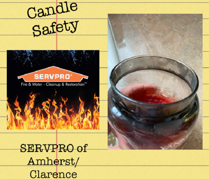 Photo shows the orange SERVPRO logo with flames around it next to a candle.