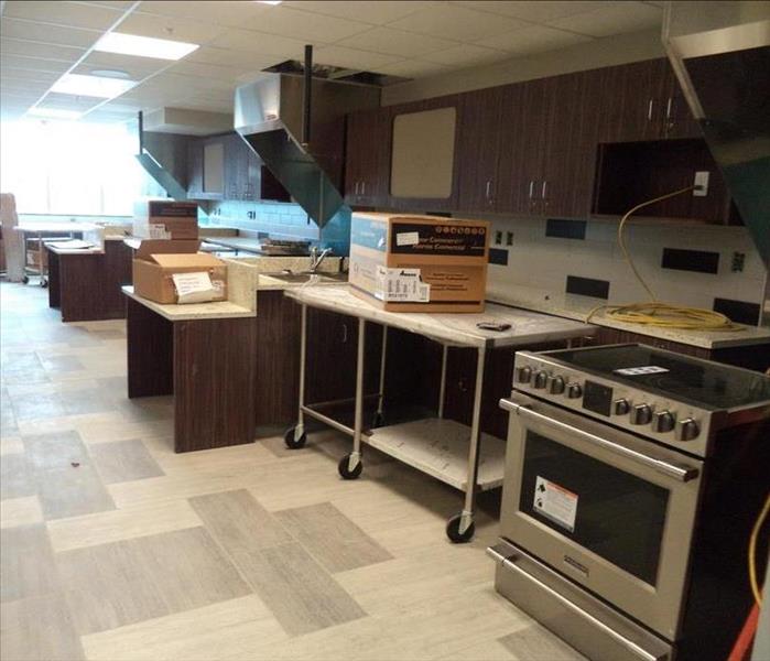 A photo of commercial kitchen used to educate students covered with drywall dust